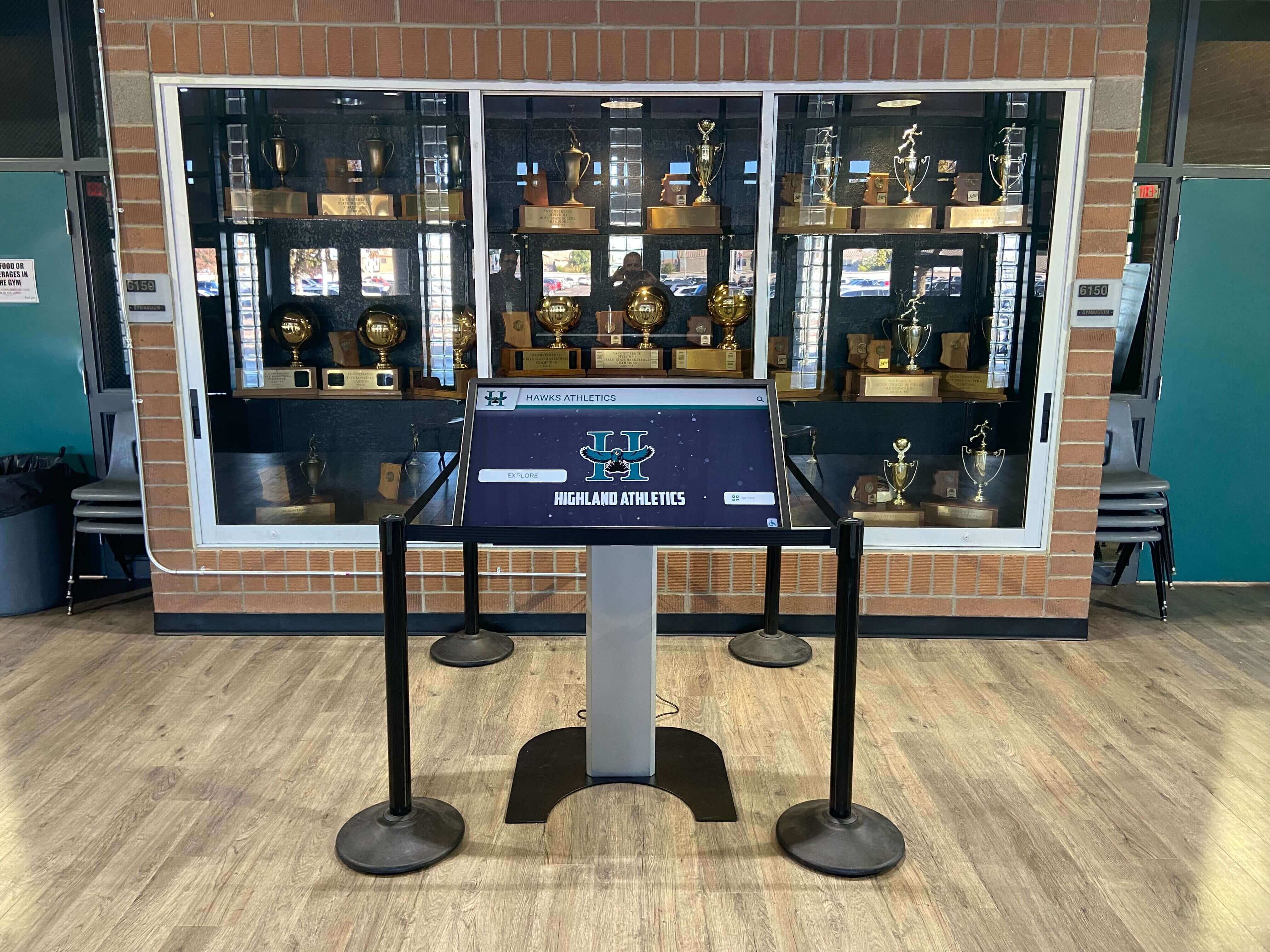 athletics touchscreen kiosk in school trophy case